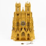 Cathedrale de Reims, an exceptional mantle clock made of gilt bronze. (15 x 31 x 47cm)