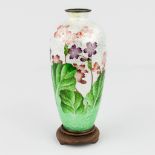 A Japanese 'Ginbari CloisonnŽ' vase with flower decor. (15 x 7 cm)