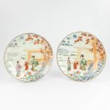 A pair of Japanese plates, with images of a ladyÊand children (4 x 40 cm)