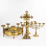 A part of a chandelier, a pair of candelabra and a crucifix, made of bronze and brass in gothic revi