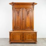 A Deux Corps cabinet made of oak with wood sculptured elements in Louis XV style. (48 x 155 x 218cm)