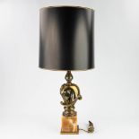 Deknudt, a table lamp with brass horse head. (93cm)