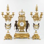 A three-piece mantle clock made of bronze and marble, Empire style (20 x 34 x 62cm)