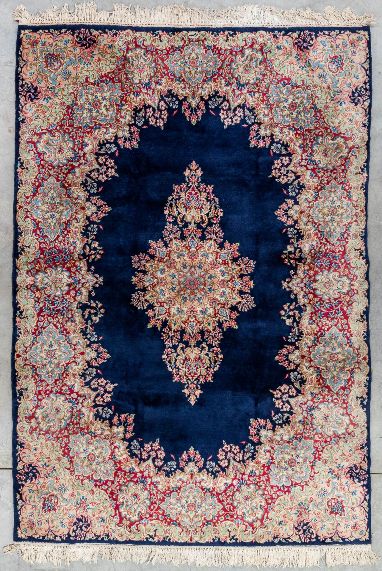 An Oriental hand-made carpet, Kerman. (310 x 215 cm)