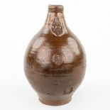 An antique Bartmann jug with a seal, made of grs stoneware in Germany (33,5 x 22cm)