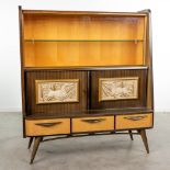 A mid-C. bar cabinet or library with sculptured panels of Antilopes, circa 1950. (50 x 129 x 144cm)