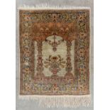 An Oriental hand-made carpet made of silk, Hereke.Ê(72 x 59 cm)