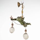 A chandelier with bronze putto and decorated with glass. (14 x 33 x 56cm)