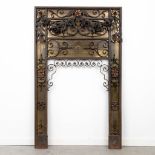 A fireplace interior made of bronze and wrought iron. (81 x 133cm)