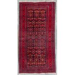 An hand-made carpet and marked Belutek, Iran.Ê(101 x 201 cm)