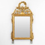 A mirror made of gold-plated sculptured wood. (63 x 118cm)