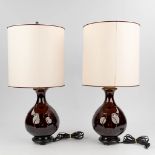 A pair of table lamps with brown-glazed ceramic base, and a lampshade. (66 x 20cm)