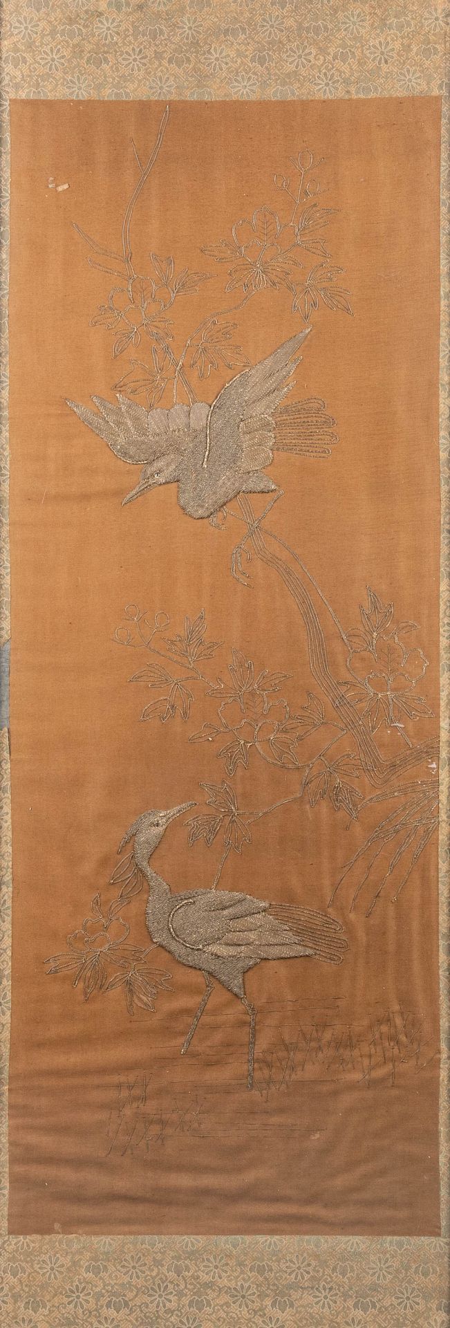 A Chinese embroidery with images of two birds, 19th C. (130 x 50 cm)