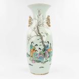 A Chinese vase made of porcelain and decorated with ladies and trees. (58 x 24 cm)