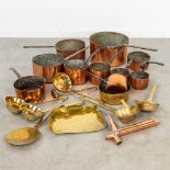 A collection of pots and accessories made of red and yellow copper.