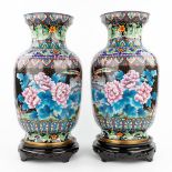 A pair of large vases, made of bronze with cloisonnŽ enamel. (52 x 28 cm)