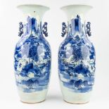 A pair of Chinese vases with blue and white decor of a mountain landscape (59 x 21 cm)