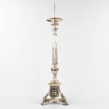 A church candlestick made of silver-plated metal, standing on claw feet. (18 x 18 x 78cm)