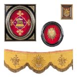 A collection of religious frames and an altar decoration. The sacred heart, Mystic lamb and Holy Gra