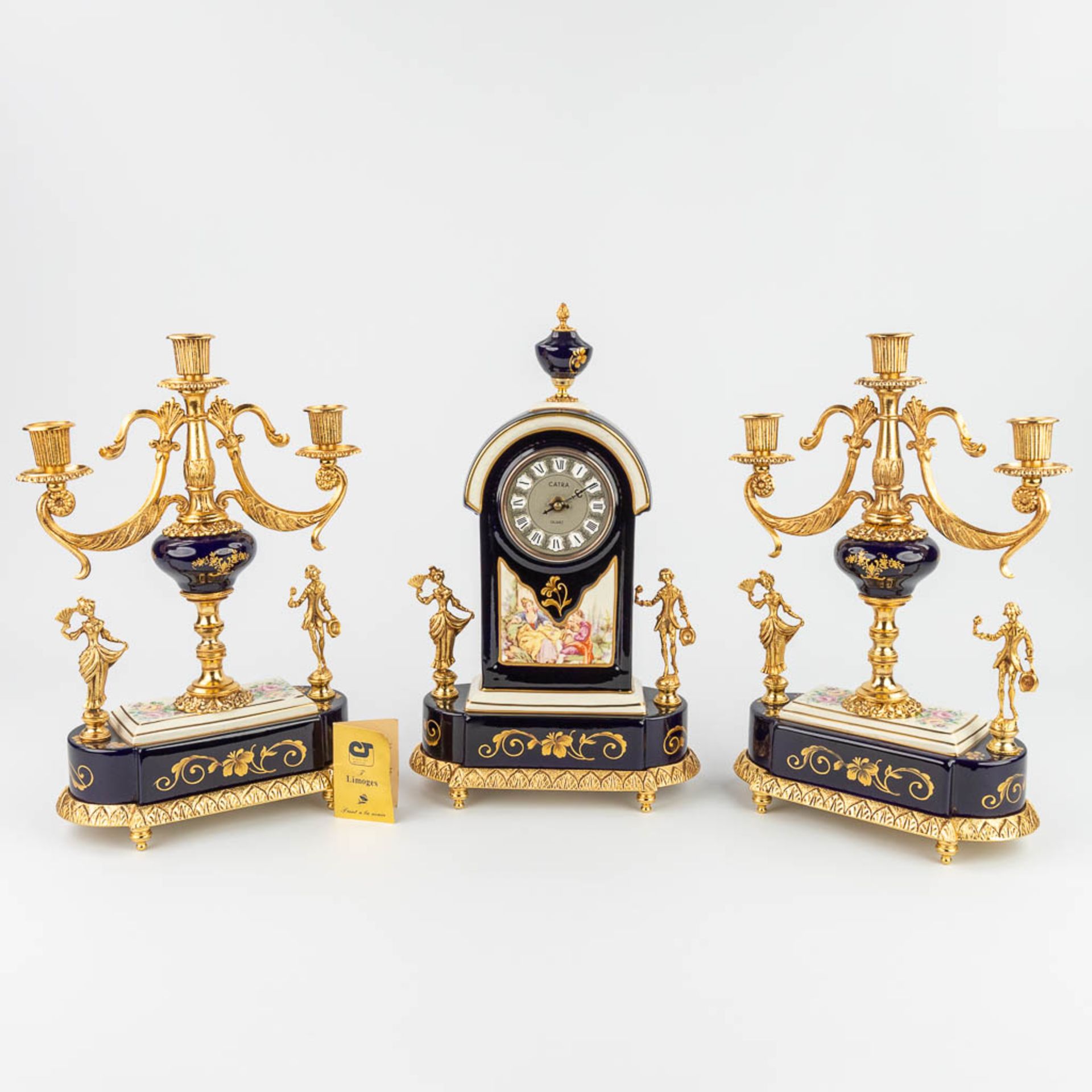 Limoges, a three-piece mantle garniture clock and candelabra, Campostrini e trallori (12 x 23 x 40cm