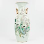 A Chinese vase made of porcelain andÊdecor of ladies near a large rock. (57,5 x 23 cm)