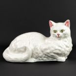 A mid-C. laying cat, made of glazed faience. (18 x 35 x 20cm)