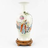 A Chinese vase 'Emperor in the garden' made of porcelain, Yang Cai mark. (44,5 x 20 cm)