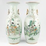 A pair of Chinese vases made of porcelain with a hand-painted decor of ladies (57 x 24 cm)