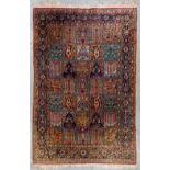 An Oriental hand-made carpet, Ghom Silk (166 x 109 cm)