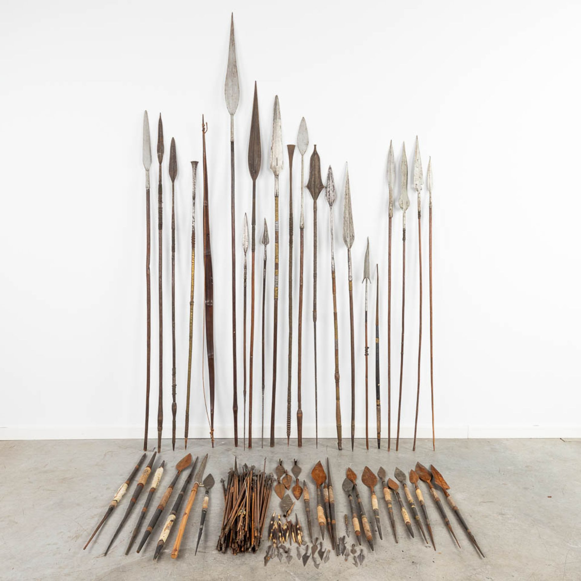 A large collection of African Spears, arrows and arrowheads. (227cm)