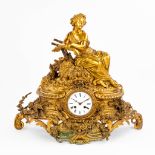 A mantle clock 'The Harvest' with an image of a resting lady. (22 x 59 x 50cm)