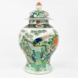 A Chinese baluster vase with lid, with a fine hand-painted decor of fauna and flora. 19th/20th C. (4