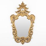 A mirror made of sculptured wood in Louis XVI style. 20th C. (56 x 95cm)