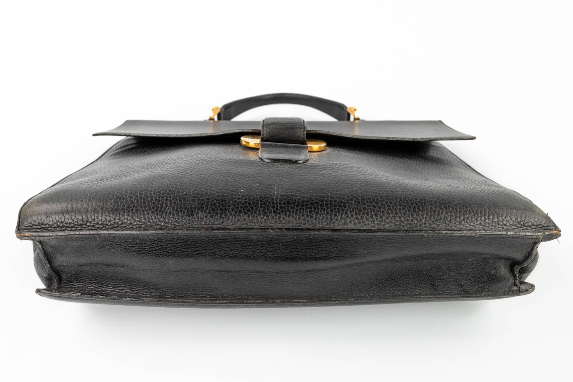 Delvaux, a suitcase made of black leather with gold-plated elements. (W:39 x H:33 cm) - Image 7 of 16