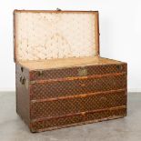 Louis Vuitton, a large and antique suitcase. (L:63 x W:113 x H:72 cm)