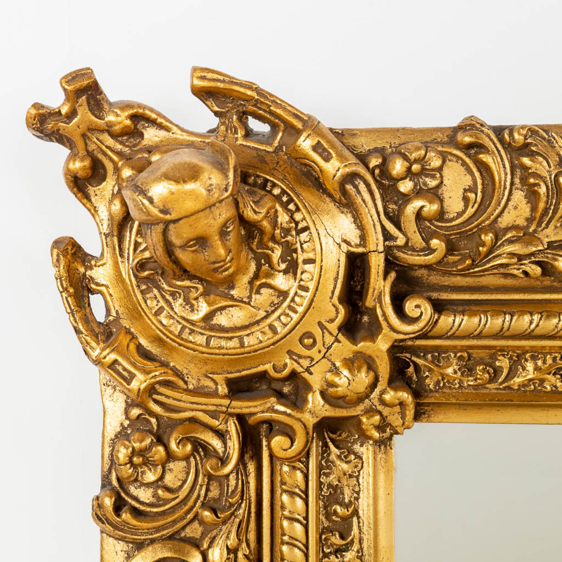 A gold-plated mirror, made of wood an stucco. 20th C. (W:104 x H:145 cm) - Image 4 of 9