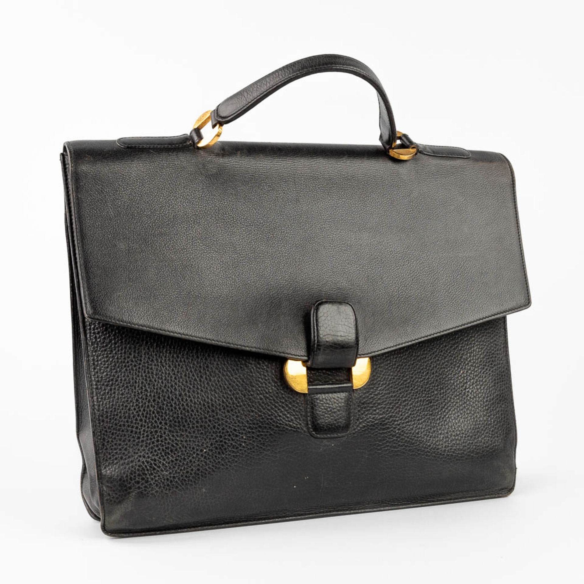 Delvaux, a suitcase made of black leather with gold-plated elements. (W:39 x H:33 cm) - Image 8 of 16