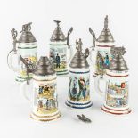 A collection of 6 'Regimental Beer Steins'. Made of porcelain with a tin lid (H:28 cm)