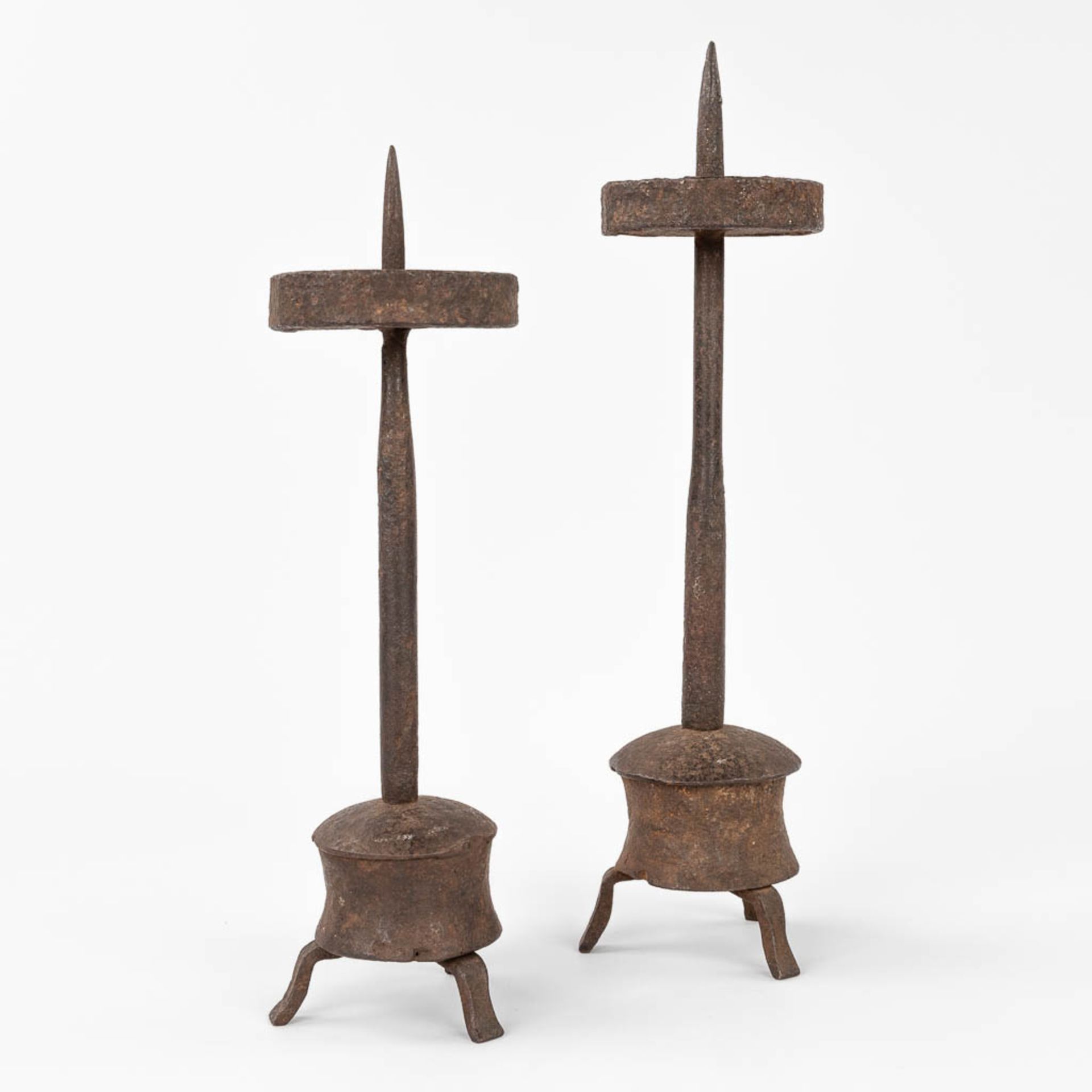 A pair of antique candlesticks made of wrought iron. Probably made in Southern Europe. (H:34 cm)