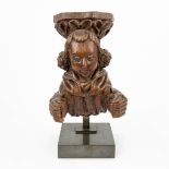 An antique wood sculptured corbel, with a medieval figurine. 19th C. (L:21 x W:19 x H:25 cm)