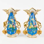 Vieux Bruxelles, A pair of vases with gold and blue decor and decorated with flowers (W:21 x H:32 cm