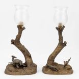 A pair of table lamps with hunting scnes, probably Vienna bronze. Circa 1900. (L:15 x W:23 x H:47
