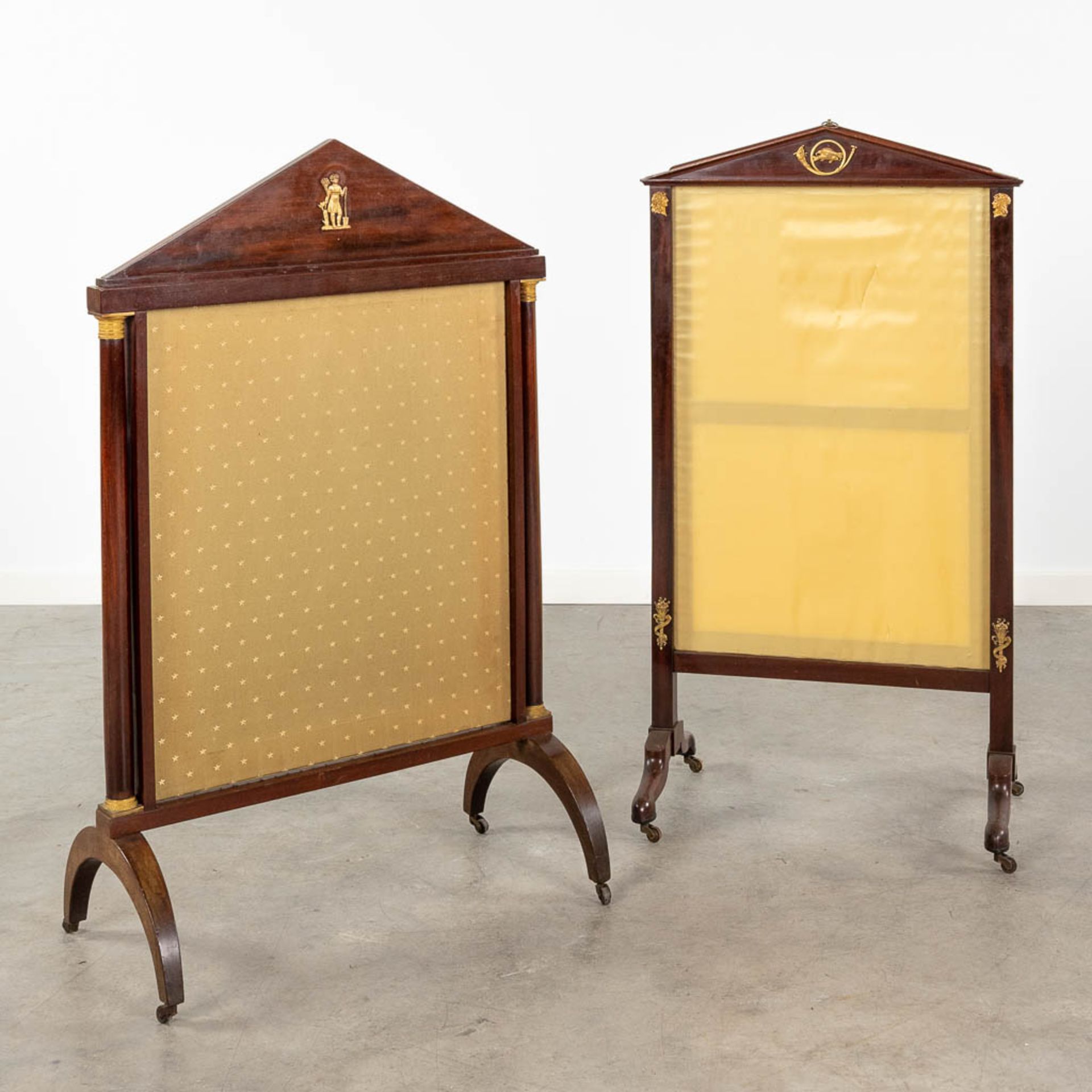 A collection of 2 fireplace screens, made of mahogany in empire style. 19th C. (W:56 x H:101 cm)