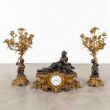 A three-piece mantle garniture clock and candelabra, Louis XV style, 19th century. (L:23 x W:63 x H