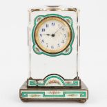 An antique table clock made of glass and finished with green enamel and cloisonnŽ (L:4 x W:6 x H:8,