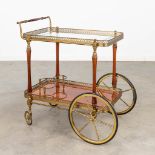 A vintage 'Bar Cart' or drinks trolley, made of brass and mahogany, in the style of Maison BaguŽs.