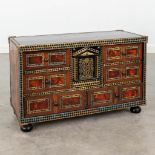 An antique show cabinet finished with marquetry inlay and tortoise shell, and finished with brass. (