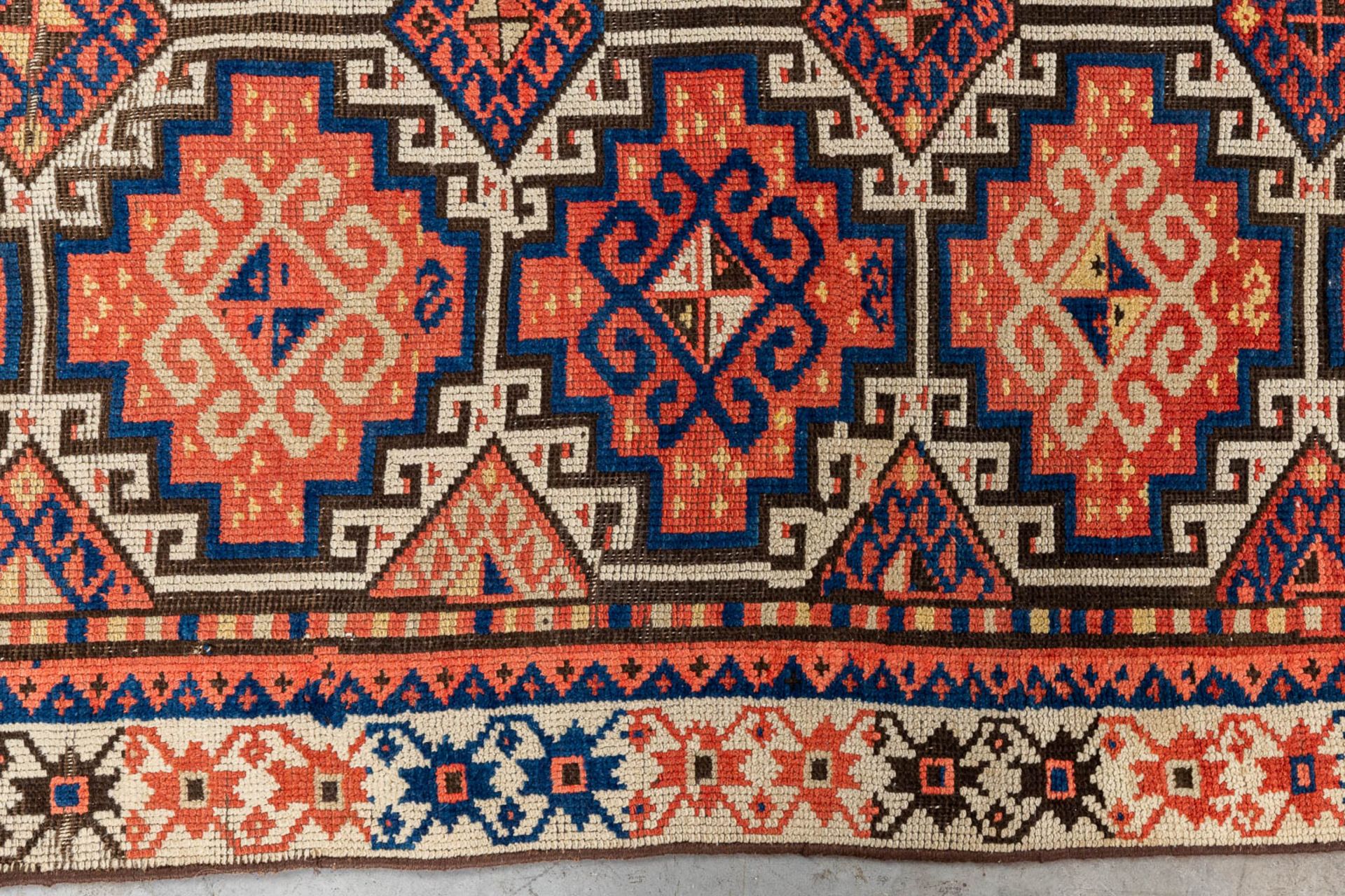 An oriental hand-made carpet. Kazak Caucasian. (L:315 x W:104 cm) - Image 5 of 9