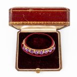 An antique bracelet, decorated with purple and white semi-precious stones in a 14-karat bracelet.