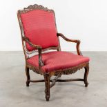 An armchair finished with red fabric and wood sculptures in Louis XV style. (L:73 x W:72 x H:108 cm